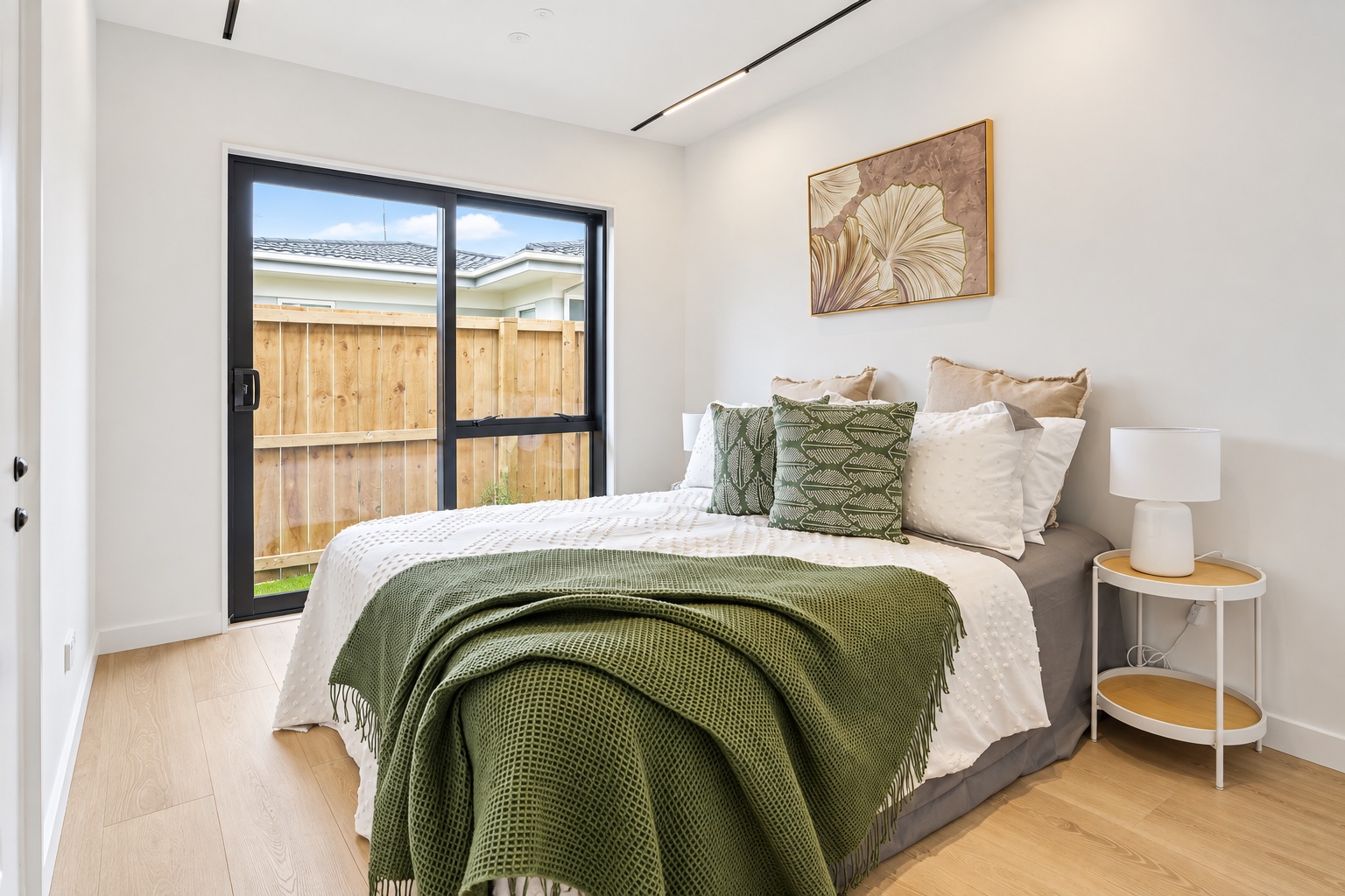Neutral bedroom with warm timber details