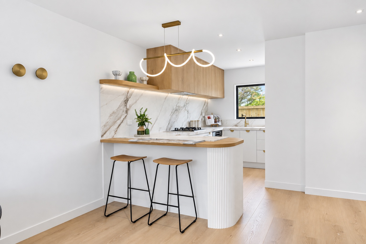 Kitchen peninsula with timber cabinetry